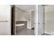 Bathroom featuring a soaking tub with stone accents, a tiled shower, and neutral color palette at 2627 Hancock St, Plant City, FL 33563