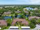 An aerial shot showcases the property's desirable setting, with trees and water views at 2681 Sabal Springs Cir # 204, Clearwater, FL 33761
