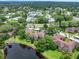 Aerial real estate image showcasing the expansive community, lush landscaping, and peaceful water at 2681 Sabal Springs Cir # 204, Clearwater, FL 33761