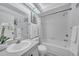 Bathroom with vanity, toilet, tub with shower, and neutral decor at 2681 Sabal Springs Cir # 204, Clearwater, FL 33761