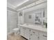 Clean bathroom with a glass-enclosed shower and a large vanity mirror at 2681 Sabal Springs Cir # 204, Clearwater, FL 33761