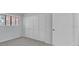 Bedroom featuring neutral walls, carpet, a window, and white closet doors at 2681 Sabal Springs Cir # 204, Clearwater, FL 33761
