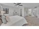 Bright bedroom with neutral palette, ceiling fan, closet, and natural light at 2681 Sabal Springs Cir # 204, Clearwater, FL 33761