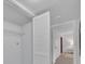 A closet space with white folding doors, designed for storage and convenience at 2681 Sabal Springs Cir # 204, Clearwater, FL 33761