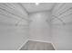 Walk-in closet with wire shelving, providing ample storage space and organization for your wardrobe at 2681 Sabal Springs Cir # 204, Clearwater, FL 33761