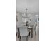 Bright dining area with modern lighting, and a view to the kitchen, perfect for Gathering meals at 2681 Sabal Springs Cir # 204, Clearwater, FL 33761