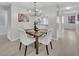 Open concept dining area with stylish lighting and a smooth flow to the living spaces, enhancing the home's appeal at 2681 Sabal Springs Cir # 204, Clearwater, FL 33761