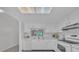 Bright kitchen features white cabinets, a window, modern appliances, and an efficient layout for easy cooking at 2681 Sabal Springs Cir # 204, Clearwater, FL 33761