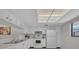 Bright kitchen featuring white cabinets, a window, modern appliances, and an efficient layout for easy cooking at 2681 Sabal Springs Cir # 204, Clearwater, FL 33761