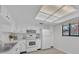 Well-lit kitchen with white cabinets, updated appliances, and an efficient layout perfect for culinary adventures at 2681 Sabal Springs Cir # 204, Clearwater, FL 33761