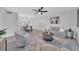 Open concept living room with neutral colored furniture and decor with view to dining area, perfect for entertaining at 2681 Sabal Springs Cir # 204, Clearwater, FL 33761