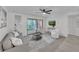 Modern living room with neutral decor, sliding glass door to balcony, and a cozy atmosphere at 2681 Sabal Springs Cir # 204, Clearwater, FL 33761