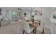 Bright and airy living room with dining area featuring stylish furnishings, neutral tones, and lots of natural light at 2681 Sabal Springs Cir # 204, Clearwater, FL 33761