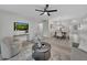 Open concept living room and dining room with stylish furnishings, modern decor, and a ceiling fan at 2681 Sabal Springs Cir # 204, Clearwater, FL 33761