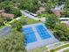 An aerial view highlights community tennis courts in the neighborhood at 2681 Sabal Springs Cir # 204, Clearwater, FL 33761