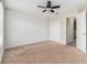 Bedroom with neutral carpet, a ceiling fan, and a large closet at 2706 Lantern Hill Ave, Brandon, FL 33511