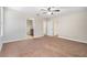 Large bedroom with adjoining bathroom and neutral walls at 2706 Lantern Hill Ave, Brandon, FL 33511