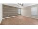 Bedroom with a ceiling fan, and large windows providing natural light at 2706 Lantern Hill Ave, Brandon, FL 33511