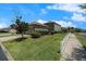 Suburban home exterior with manicured lawn and shrubs at 2706 Lantern Hill Ave, Brandon, FL 33511