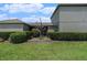 Home's front entrance with a manicured lawn and sculpted shrubbery at 2706 Lantern Hill Ave, Brandon, FL 33511