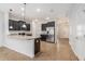 Bright, modern kitchen with granite countertops, stainless steel appliances, and dark cabinetry, with ample counter space at 2706 Lantern Hill Ave, Brandon, FL 33511