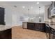 Spacious kitchen with dark cabinets, granite countertops, and stainless steel appliances, and an open layout at 2706 Lantern Hill Ave, Brandon, FL 33511