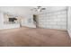 Spacious living room featuring open floor plan, decorative wall, and a mix of tile and carpet at 2706 Lantern Hill Ave, Brandon, FL 33511