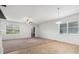 Open living room featuring tile and carpet flooring and an abundance of natural light at 2706 Lantern Hill Ave, Brandon, FL 33511