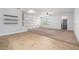 Bright open living room with decorative wall, and a mix of tile and carpet flooring at 2706 Lantern Hill Ave, Brandon, FL 33511