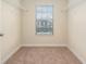 Carpeted walk-in closet with shelving and a window at 2706 Lantern Hill Ave, Brandon, FL 33511
