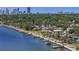 Waterfront homes with docks, lush green trees, and beautiful skyline at 2800 Coffee Pot Ne Blvd, St Petersburg, FL 33704