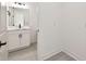 Modern bathroom featuring a vanity with a marble countertop and updated fixtures and hardware at 301 S Daniels St, Plant City, FL 33563