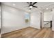 Bedroom with wood-look floors and a window at 301 S Daniels St, Plant City, FL 33563