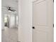 Bedroom featuring doorway, tile floors and views of the bathroom and windows at 301 S Daniels St, Plant City, FL 33563