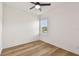 Bedroom with wood-look floors, window, and natural lighting at 301 S Daniels St, Plant City, FL 33563