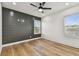 A bedroom featuring a dark accent wall and natural light at 301 S Daniels St, Plant City, FL 33563