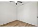 Clean and bright bedroom with hardwood floors, white walls, and a ceiling fan at 301 S Daniels St, Plant City, FL 33563