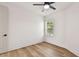 Bedroom with wood-look floors, window, and neutral walls at 301 S Daniels St, Plant City, FL 33563