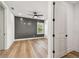 Bedroom featuring a dark accent wall, and wood-look floors at 301 S Daniels St, Plant City, FL 33563