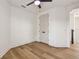 Bright bedroom with wood-look floors and ceiling fan at 301 S Daniels St, Plant City, FL 33563