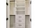 Bedroom closet with white shelving and drawers, providing organized storage space at 301 S Daniels St, Plant City, FL 33563