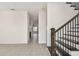 Open and airy foyer with gray tile flooring and a view of the staircase at 301 S Daniels St, Plant City, FL 33563