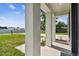 Welcoming covered front porch area with stone pillars and landscaping at 301 S Daniels St, Plant City, FL 33563