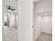 Hallway featuring a view to the bedroom and bonus storage space with tile flooring at 301 S Daniels St, Plant City, FL 33563