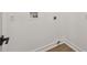 Laundry room with wood-look floors and white walls at 301 S Daniels St, Plant City, FL 33563