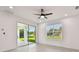 Bright living room with recessed lighting, a sliding glass door, and a window with backyard views at 301 S Daniels St, Plant City, FL 33563