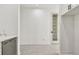 View of kitchen pantry with white walls and gray wood-look tile flooring at 301 S Daniels St, Plant City, FL 33563