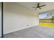 Covered patio with ceiling fan overlooking the yard at 301 S Daniels St, Plant City, FL 33563