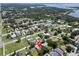 Sprawling aerial view of a residential neighborhood with a mix of homes, trees, and green spaces at 3115 Bay Ln, Clearwater, FL 33759