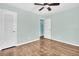 Inviting bedroom with hardwood floors, neutral walls, and two doorways offering an open layout at 3115 Bay Ln, Clearwater, FL 33759
